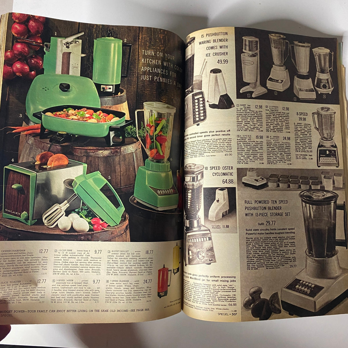 1969 Spiegel Spring and Summer Catalog page presenting kitchen appliances including a blender, food processor, and a multi-speed blender, reflecting mid-century kitchen design innovations.