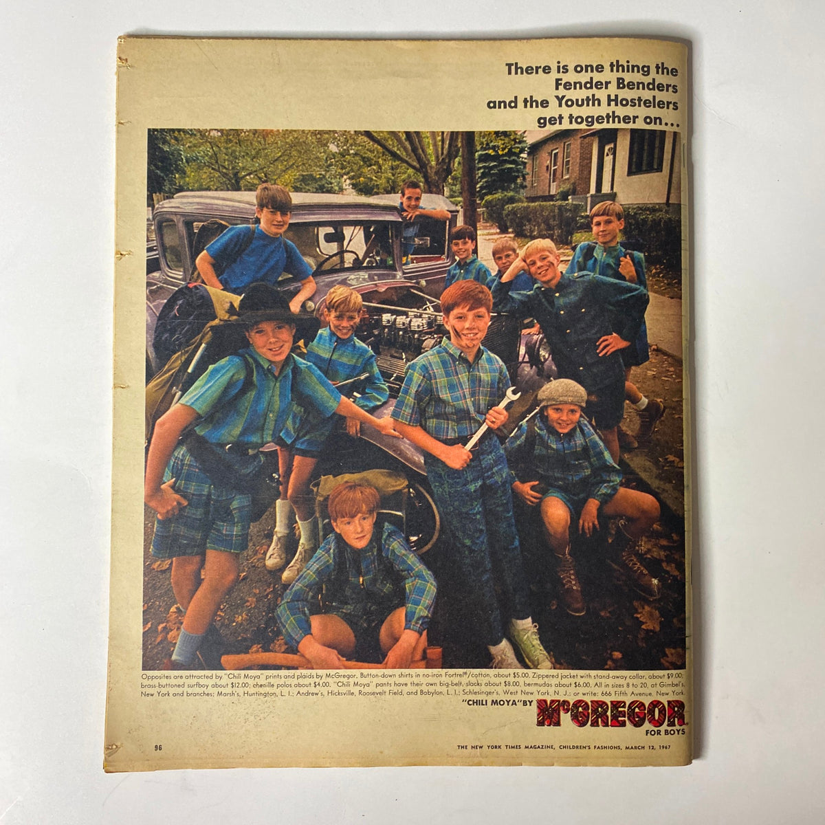 The New York Times Magazine March 12, 1967 Children's Fashion - A group of boys posing in stylish plaid outfits, showcasing contemporary children's fashion trends from the late 1960s. The boys stand beside a vintage car in a park setting, emphasizing the playful and bold styles highlighted in the magazine issue.