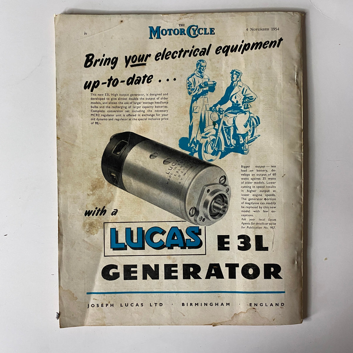 Cover advertisement from The Motor Cycle Magazine November 4, 1954, promoting the Lucas E3L generator with a detailed description of its features.