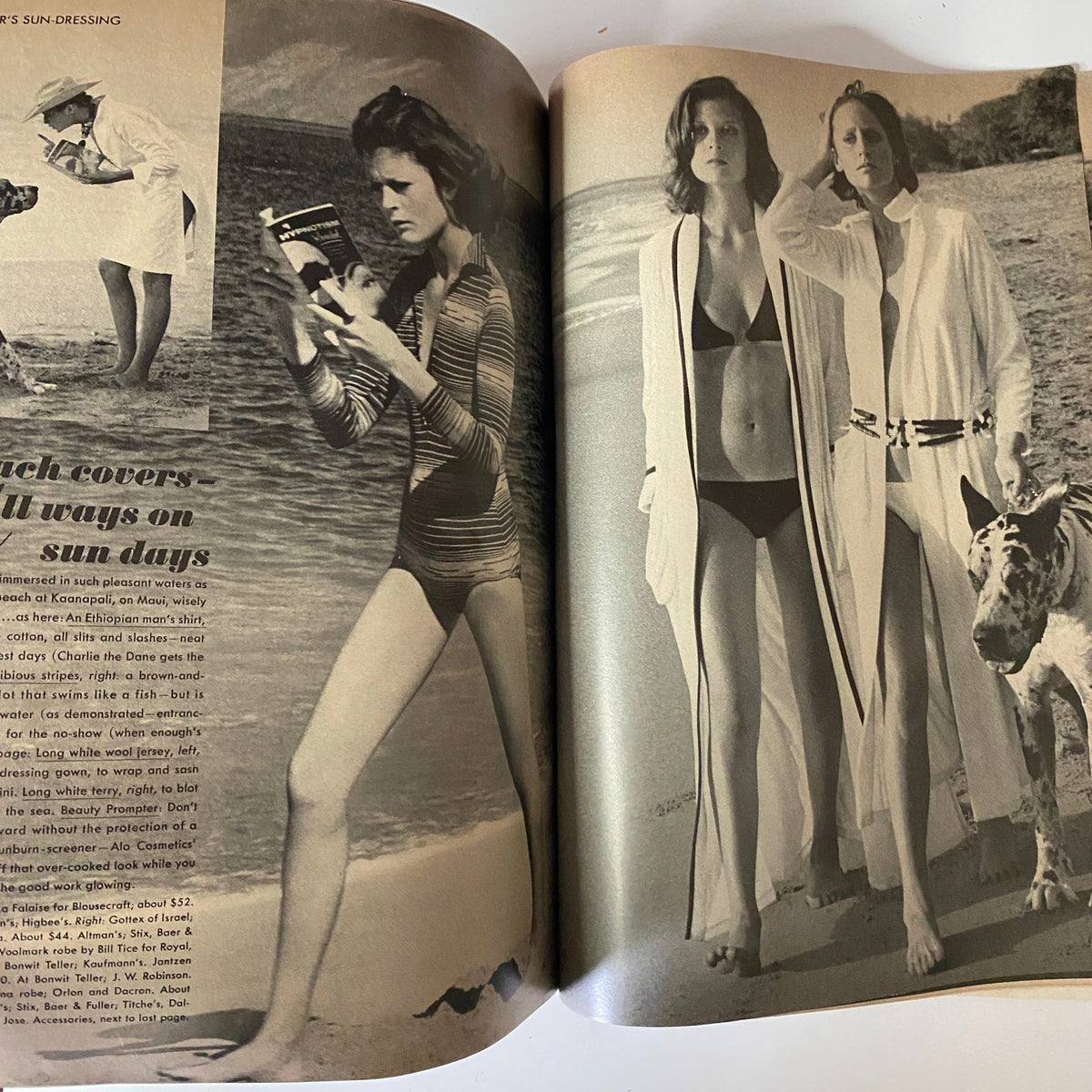 Vogue Magazine January 1, 1972 Lauren Hutton Cover GD Interior showcasing models in stylish beachwear; one model poses playfully with a camera while another poses on the beach with a dog.