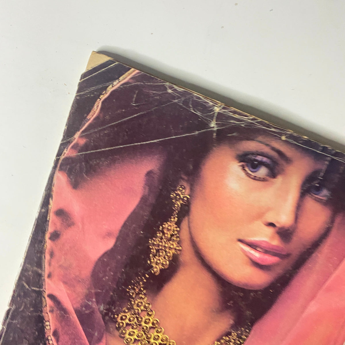 Detail of the Vogue Magazine September 15, 1971 cover featuring a model adorned with exquisite jewelry from Monet, focusing on vintage fashion elements.