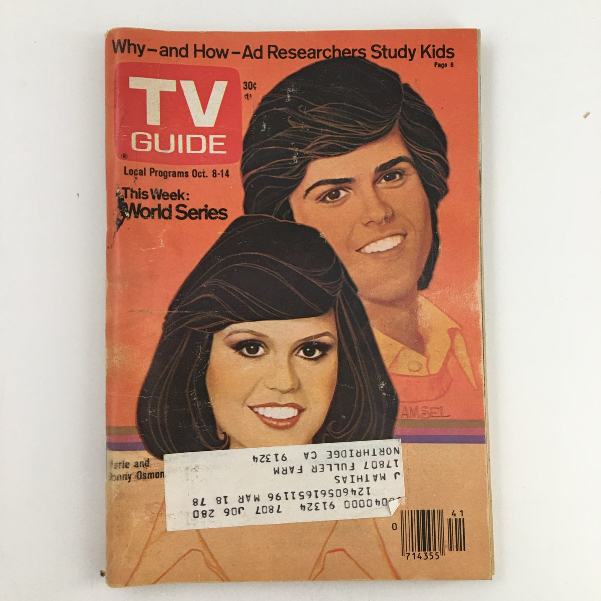 TV Guide Magazine cover from October 8, 1977 featuring Marie and Donny Osmond. The magazine highlights local programs and includes references to the World Series. It showcases the iconic siblings against a retro background, capturing a nostalgic moment in television history.