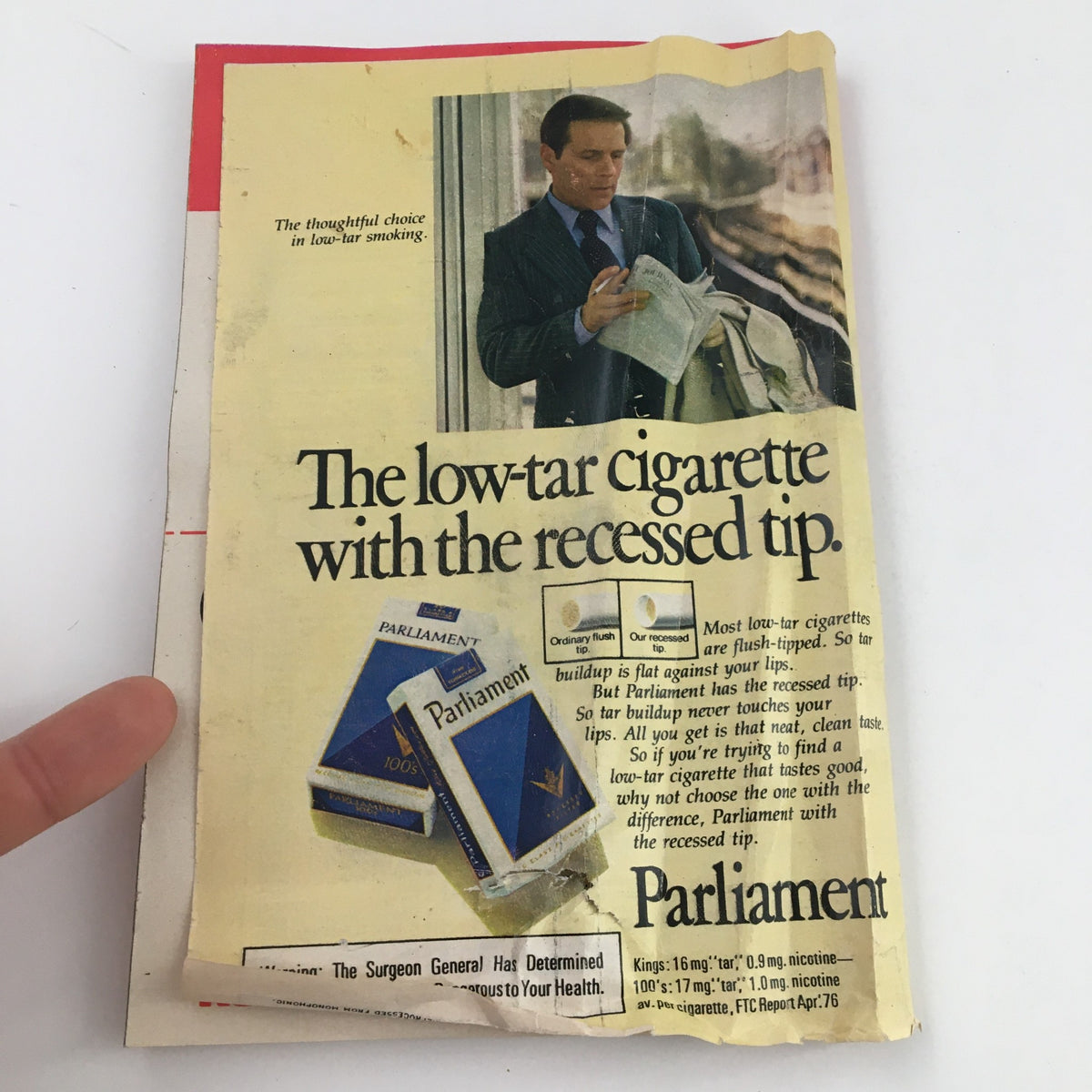 TV Guide Magazine November 6 1976 vintage advertisement for Parliament cigarettes featuring a man holding a newspaper, illustrating advertising trends of the 1970s.