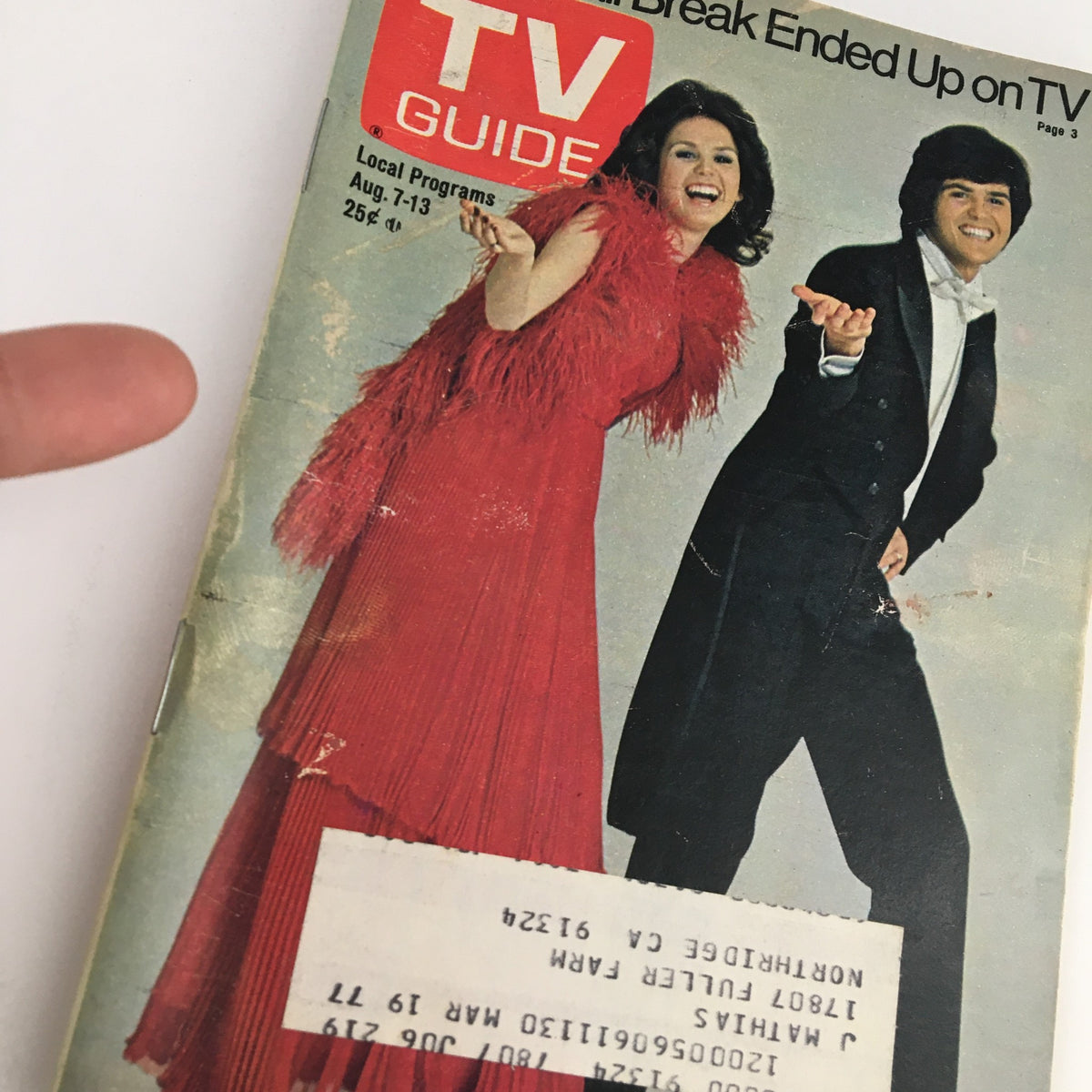 Close-up of the TV Guide Magazine August 7 1976 cover, highlighting Marie and Danny Osmond's vibrant attire and features.