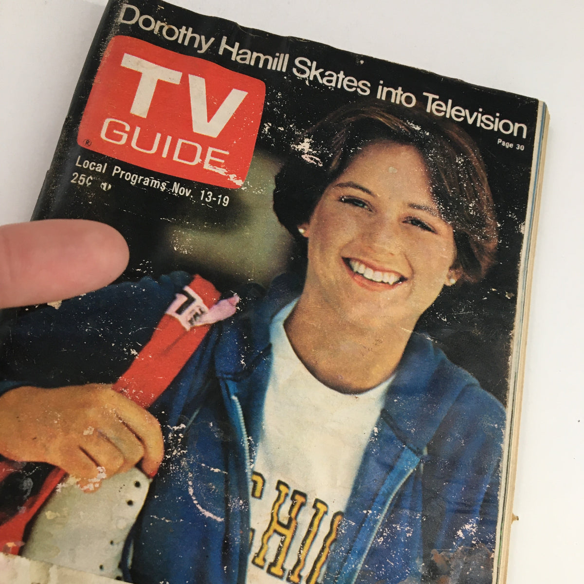 Close-up view of the front cover of TV Guide Magazine November 13, 1976, showcasing Dorothy Hamill smiling with her skates.