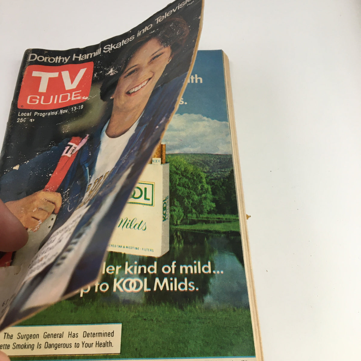 Side view of TV Guide Magazine November 13, 1976, illustrating the edge of the cover with Dorothy Hamill featured prominently.