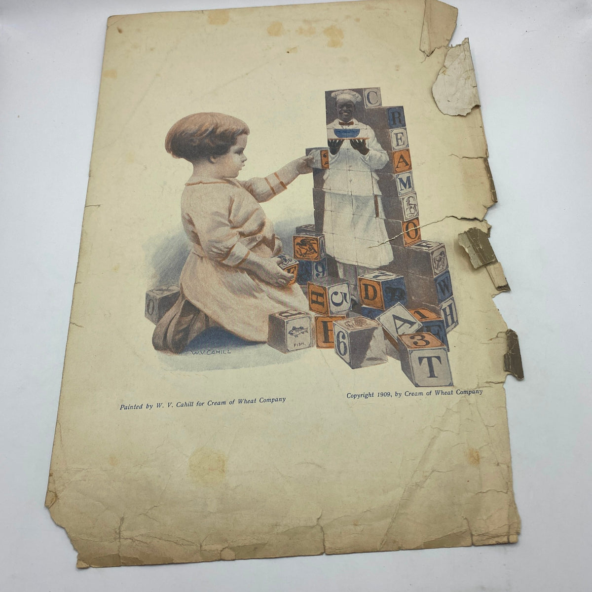 Back cover of the February 1910 The Ladies Home Journal, featuring a charming illustration by W.V. Cahill of a child playing with alphabet blocks, reflecting the era's cultural trends.