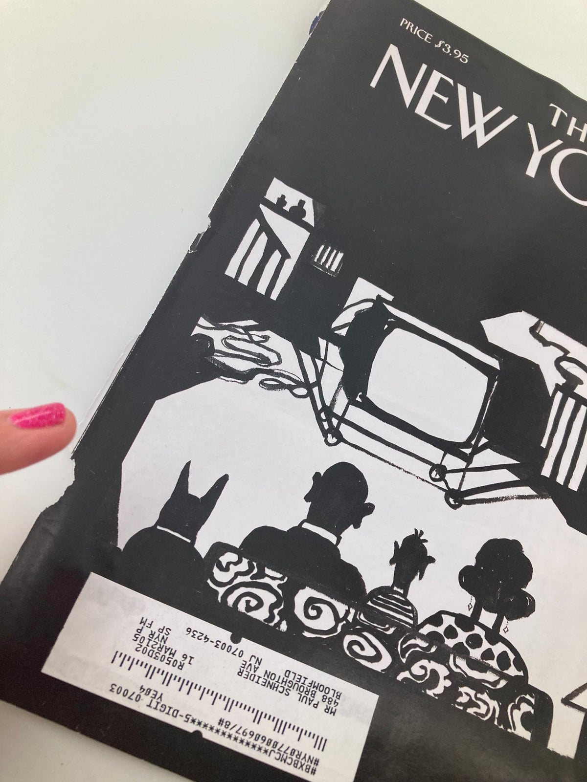Close-up view of The New Yorker cover from January 17, 2005, showcasing a black and white illustration by Saul Steinberg, focusing on a family and a dog in front of a television, reflecting themes of compassion.
