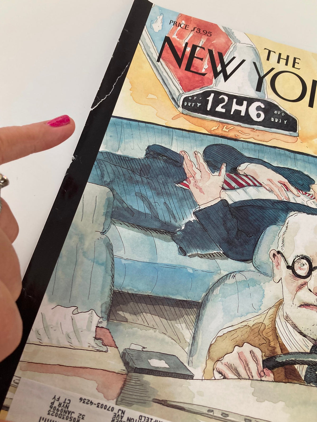 Detailed view of wear on The New Yorker May 23 2005 cover, featuring Barry Blitt's artwork, emphasizing rips and markings while maintaining its artistic value.