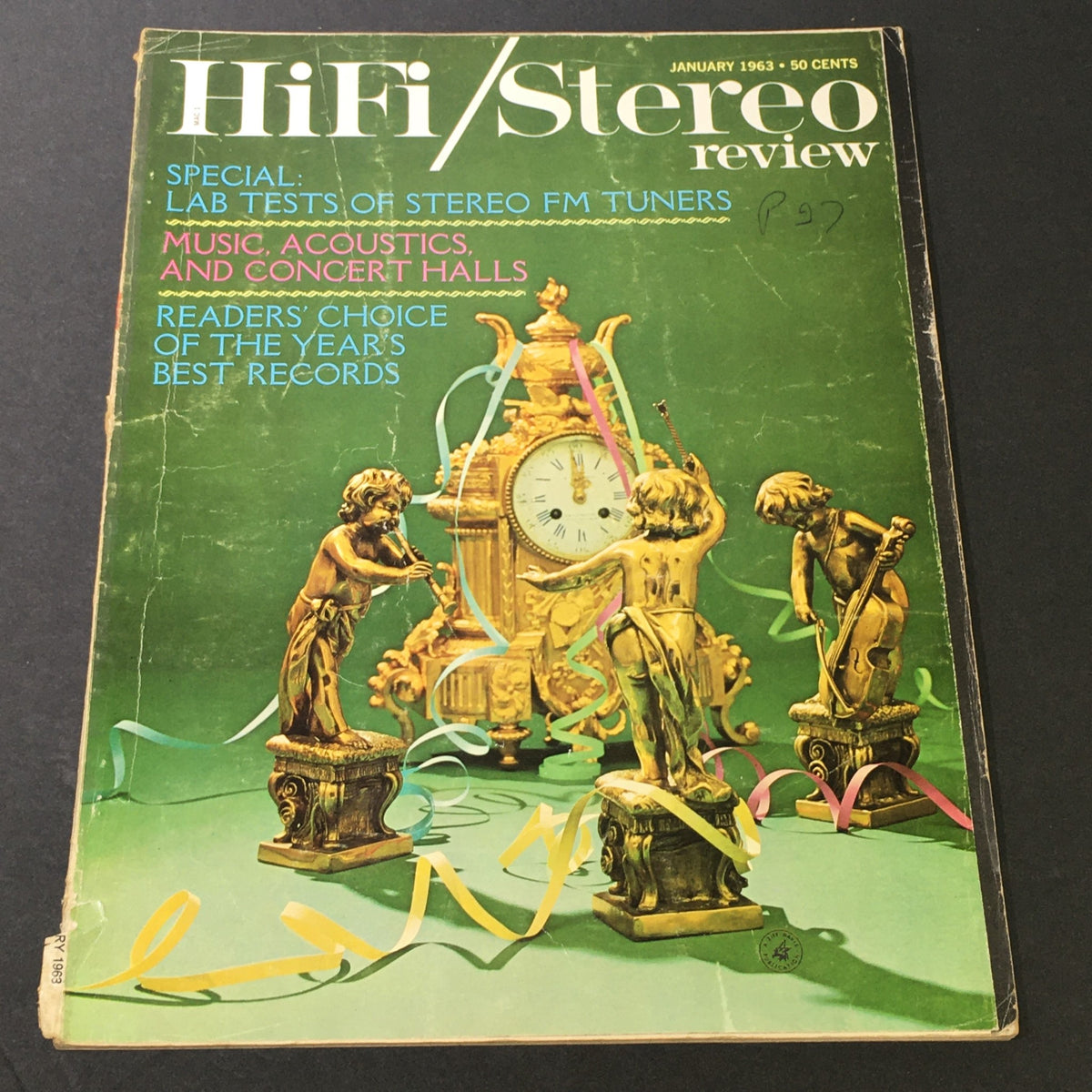 Cover of the HiFi Stereo Review Magazine January 1963, featuring special topics on stereo FM tuners, music acoustics, and concert halls, with decorative elements including gold figurines and colorful streamers.