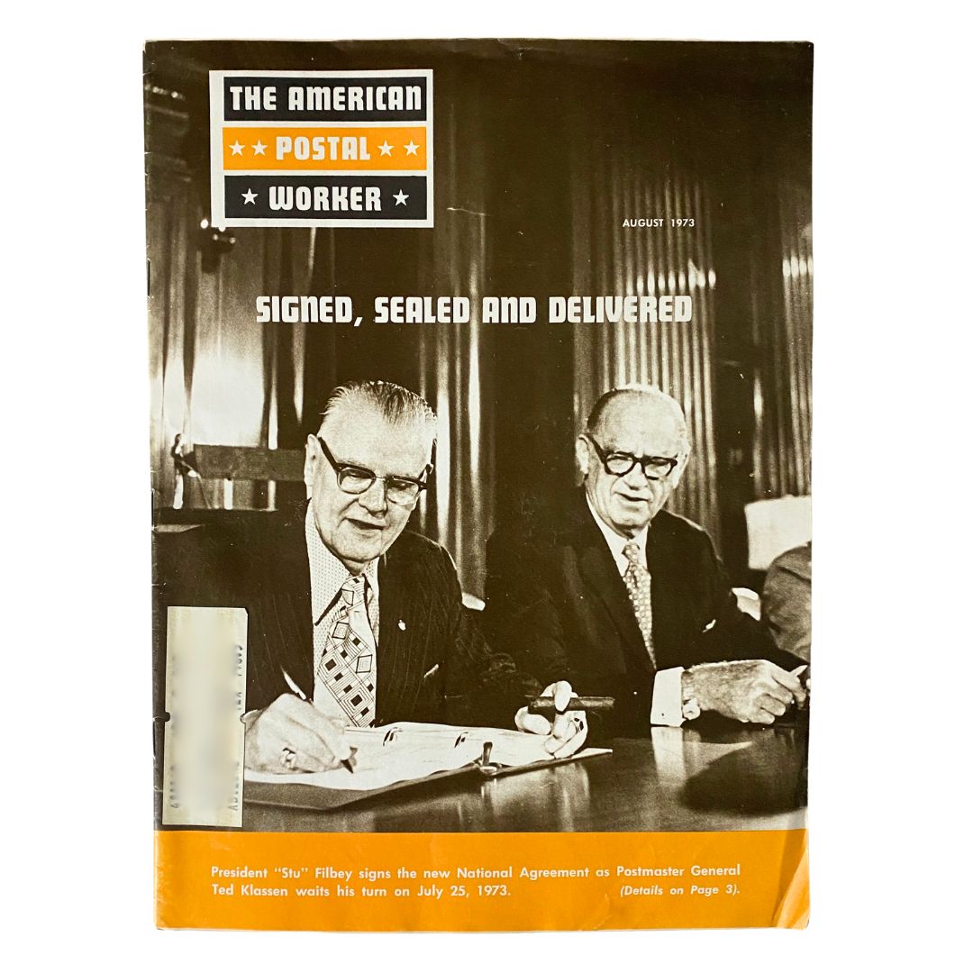 Cover of The American Postal Worker Magazine August 1973 featuring President Stu Filbey signing the National Agreement with Ted Klassen, showcasing the historical significance of postal service leadership.
