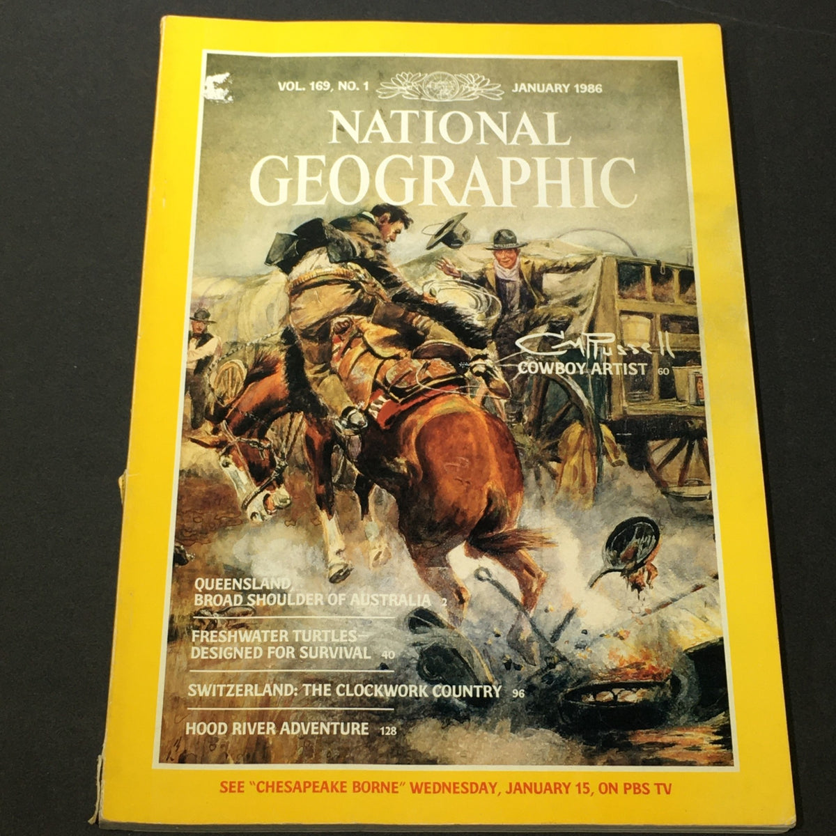 Cover of National Geographic Magazine from January 1986 featuring Charley Russell, Cowboy Artist, showcasing a vibrant illustration related to the American West.