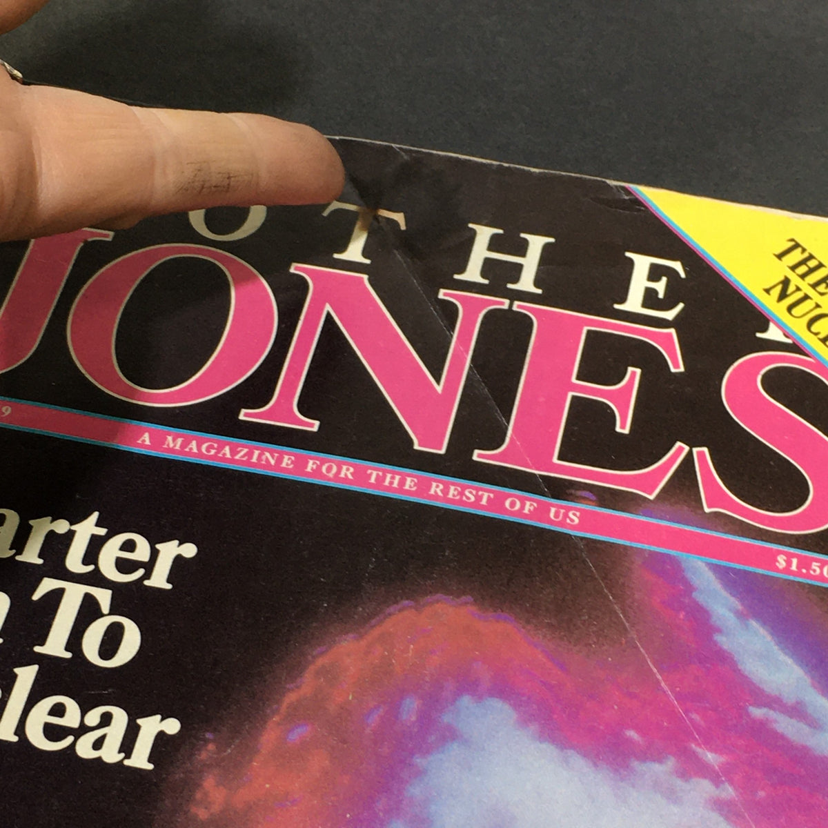 Close-up of the title and details on the cover of VTG Mother Jones Magazine June 1979, discussing Jimmy Carter's involvement with the nuclear industry.