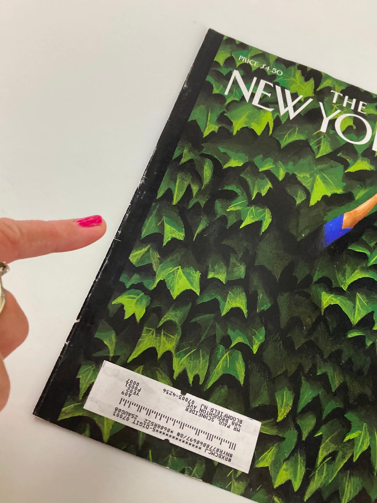 Detailed view of The New Yorker April 7, 2008 cover 'Lost and Found' by Mark Ulriksen, showing the magazine edge and a finger pointing at the binding, highlighting its collectible condition.