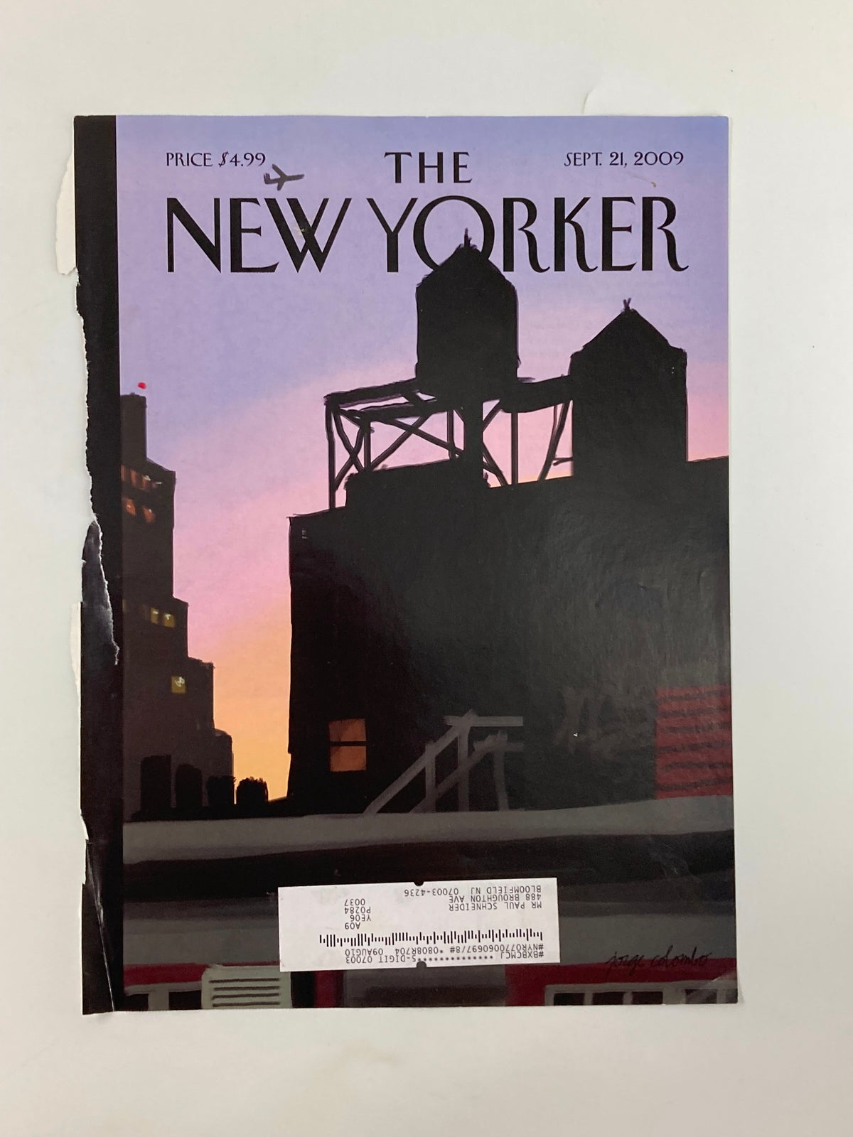 Close-up shot of The New Yorker September 21, 2009 cover displaying the finger painting 'New Day' by J. Colombo, with visible wear and an address label.