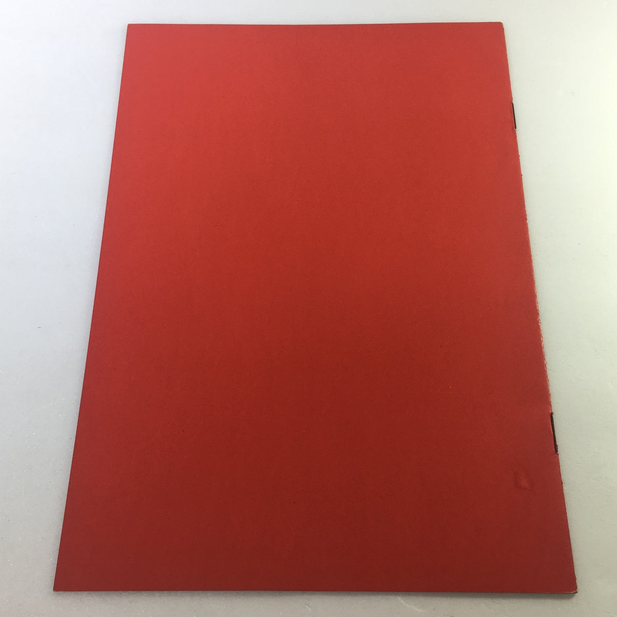 Back cover of the VTG January 21 1910 Military Education and Sports Armory of Company "M" document, featuring a simple red design. A noteworthy piece for collectors and history enthusiasts.