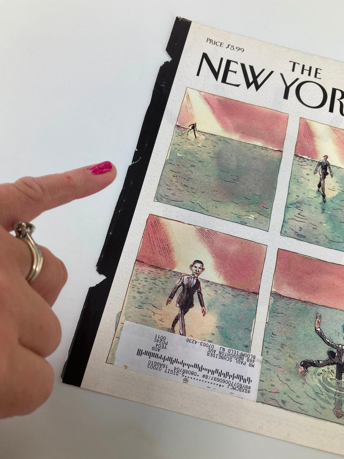 Cover of The New Yorker February 1 2010 First Anniversary by Barry Blitt with a close-up view showing detailing and a hand pointing at the magazine's binding.