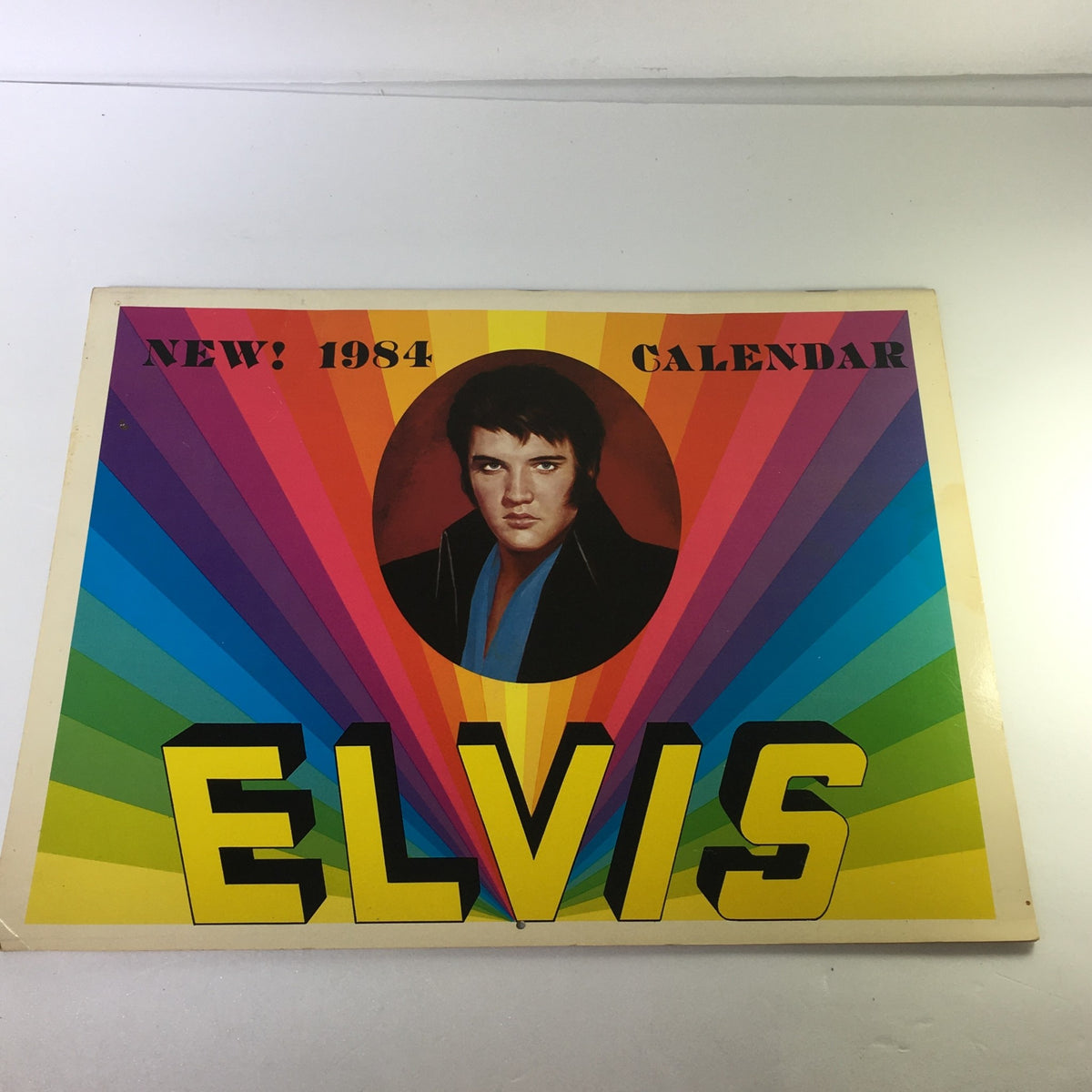VTG 1984 Elvis Presley's Love Me Tender & Birthplace Graceland Photo Calendar cover featuring a vibrant design with a portrait of Elvis Presley.