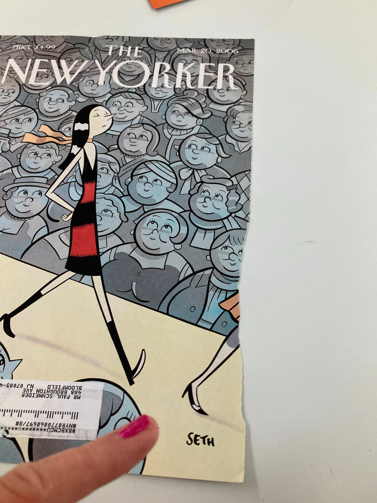 Close-up of The New Yorker March 20 2006 cover art, 'The Skinny on Fashion' by Seth, depicting a stylish model and an audience, with visible wear and a label on the cover.
