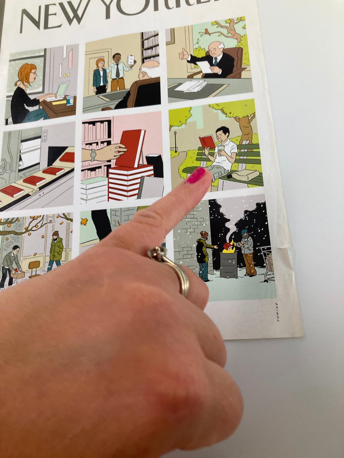 Detail of The New Yorker cover, February 25, 2008, by Adrian Tomine, focusing on a hand pointing to a character reading amidst illustrated scenes, reflecting the unique artistic elements of the cover.