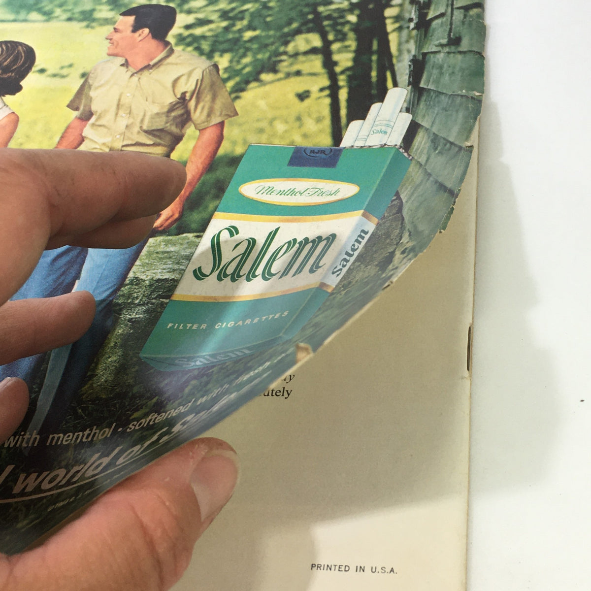 Vintage magazine page showing a hand holding a Salem cigarette advertisement from The Saturday Evening Post featuring Johnny Unitas, December 12, 1964.