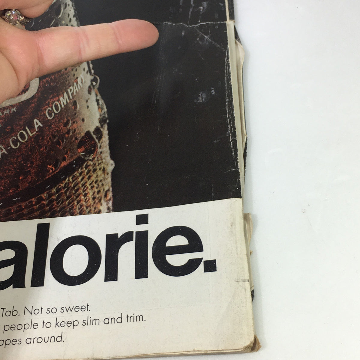 Detailed view of the back cover of VTG The Saturday Evening Post April 9 1966 magazine, highlighting a Coca-Cola advertisement and signs of aging.