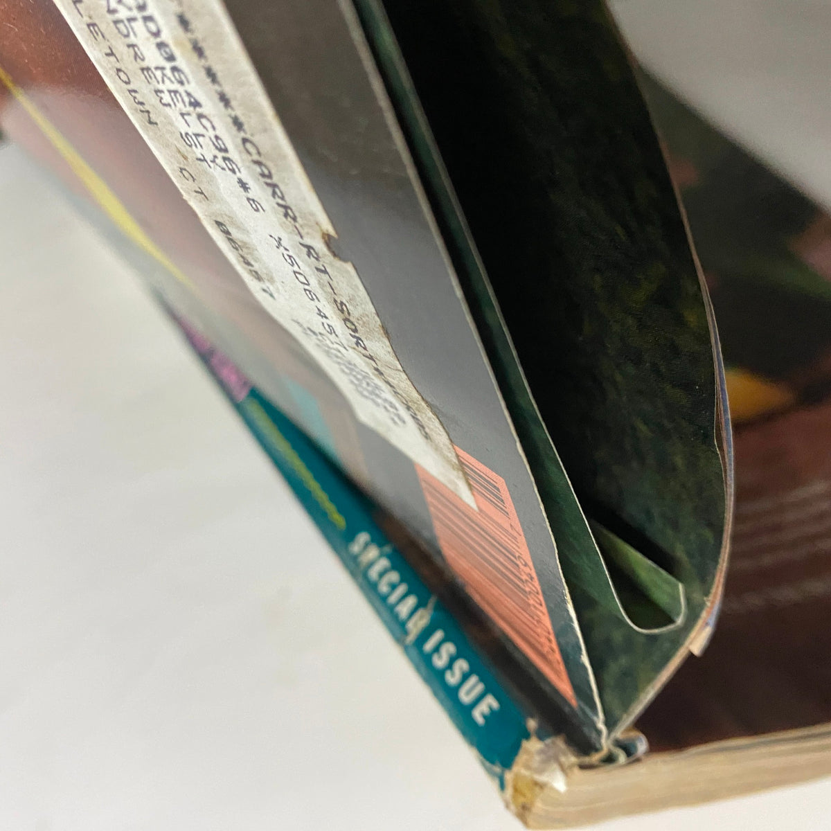 Side view of the Vintage Sports Illustrated Magazine 1989 Kathy Ireland Swimsuit Issue, showcasing the spine and cover integrity of this collectible magazine.