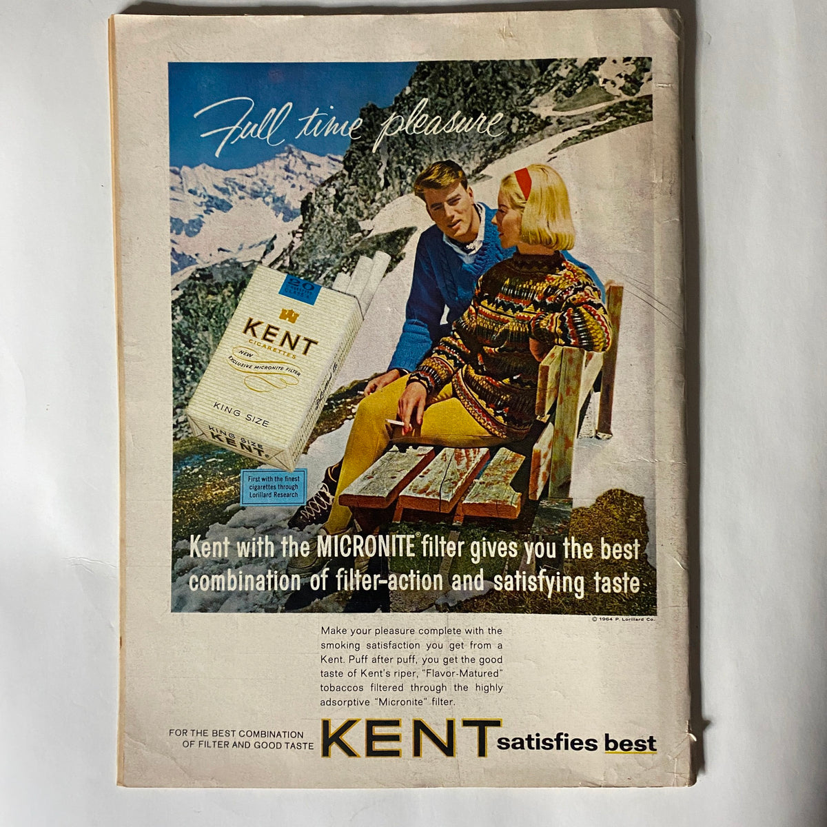 Advertisment page from the January 6, 1964 Newsweek Magazine, promoting Kent cigarettes, within the issue featuring Jacqueline Kennedy titled 'Looking Ahead'.