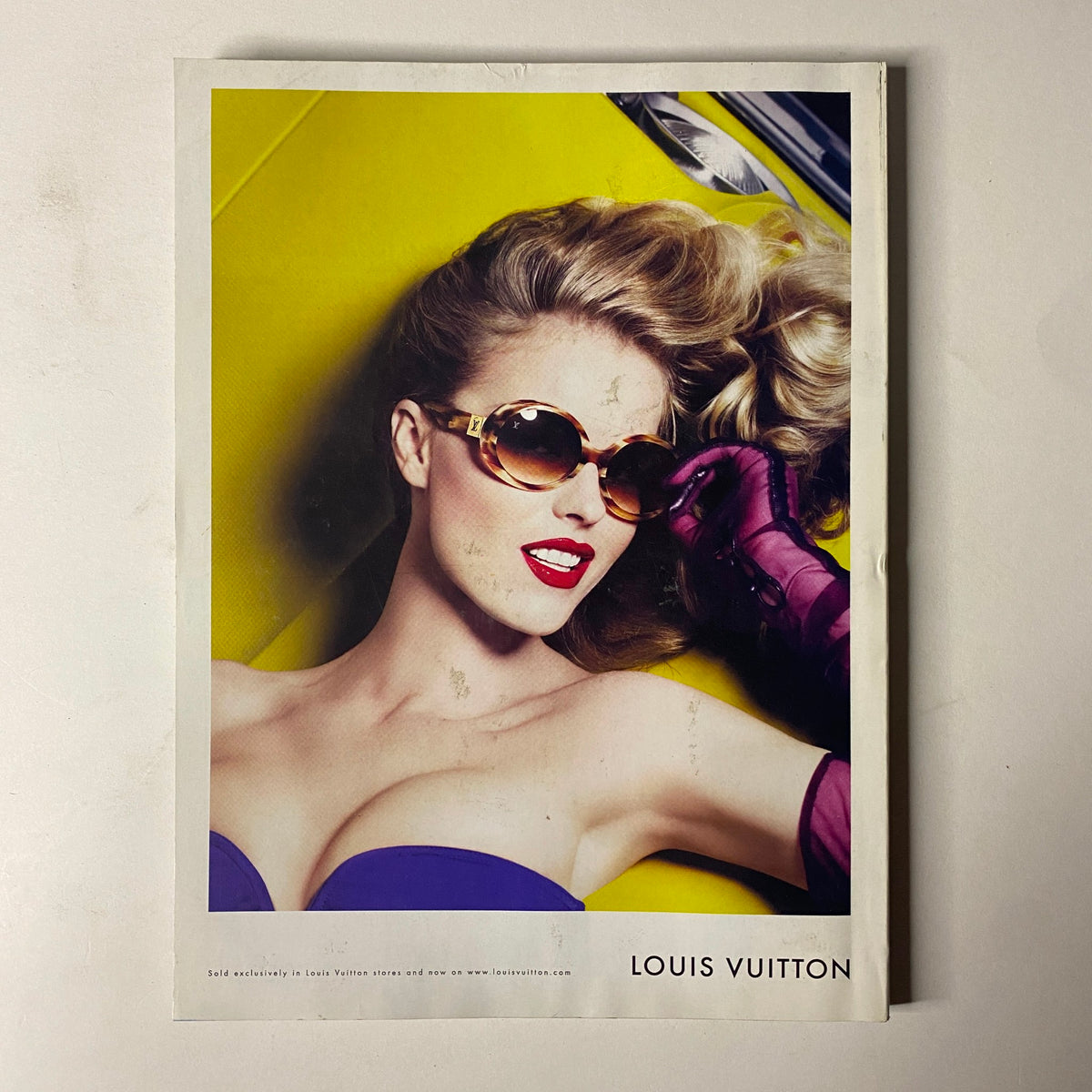 Vogue Magazine July 2008 featuring a Louis Vuitton advertisement with a glamorous model wearing stylish sunglasses against a bold yellow backdrop.