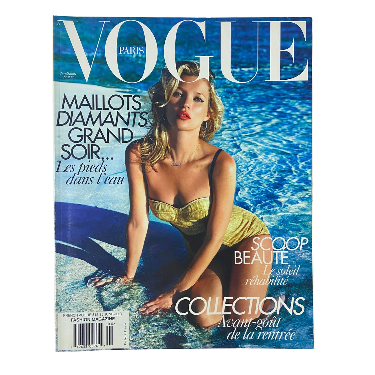 Vogue Paris Magazine June - July 2010 No. 908 featuring a stunning cover photograph of a model in a yellow swimsuit by the water, showcasing summer fashion.