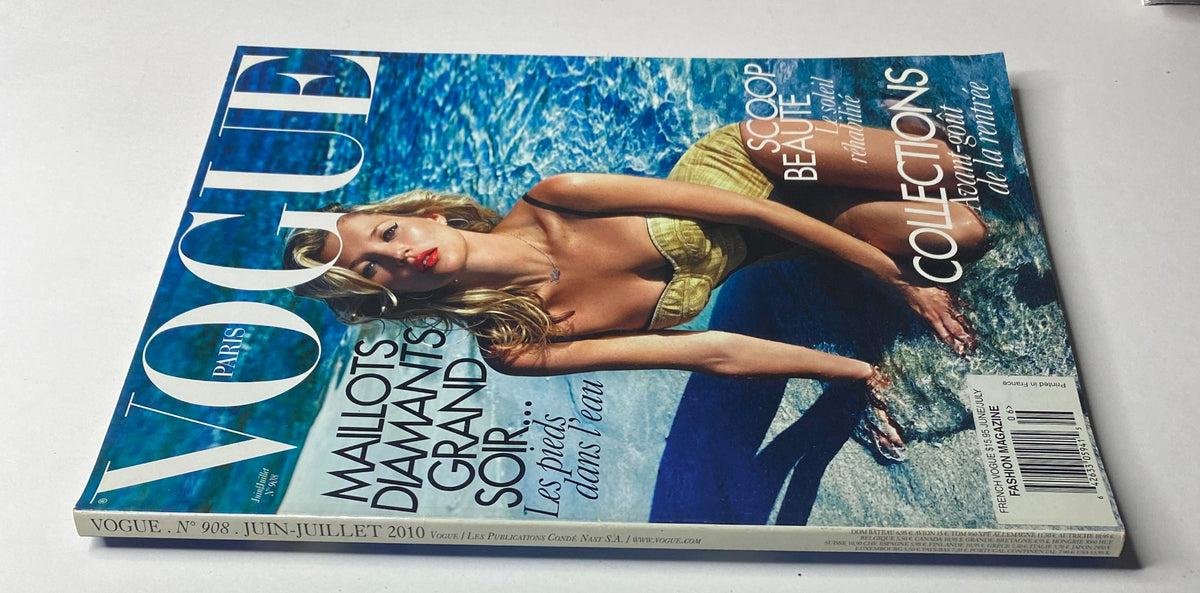 Vogue Paris Magazine June - July 2010 No. 908 viewed from the side, highlighting the model in a striking yellow swimsuit, capturing the essence of summer glamour.