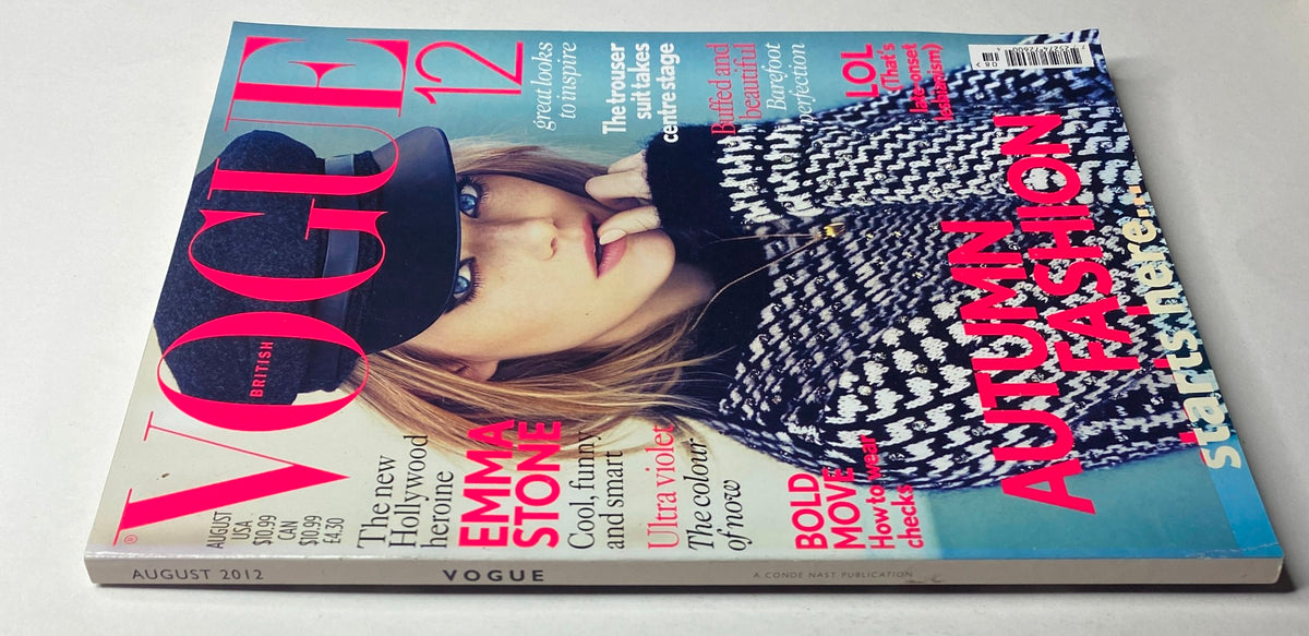 Close-up view of Vogue British Magazine August 2012 Emma Stone Cover No Label VG, featuring striking colors and designs, emphasizing Emma Stone's fashion-forward look.