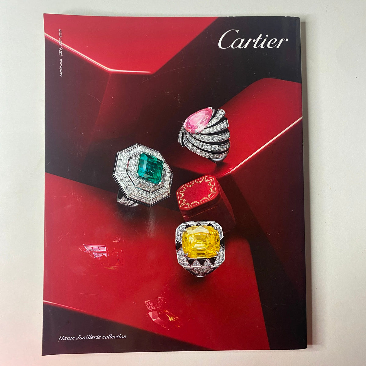 Cartier Haute Joaillerie collection magazine cover featuring stunning rings with emerald, pink, and yellow gemstones, showcasing elegant design and luxury, associated with the Vogue British Magazine June 2013 featuring Kate Moss.
