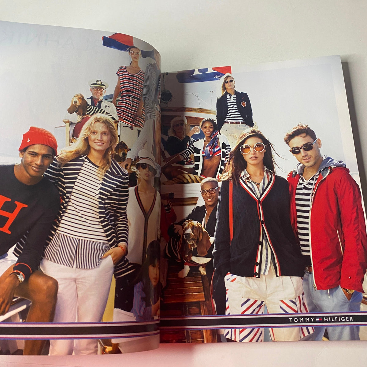 Vogue British Magazine March 2013 Cara Delevingne Cover featuring a vibrant Tommy Hilfiger fashion shoot with models dressed in nautical-themed apparel.