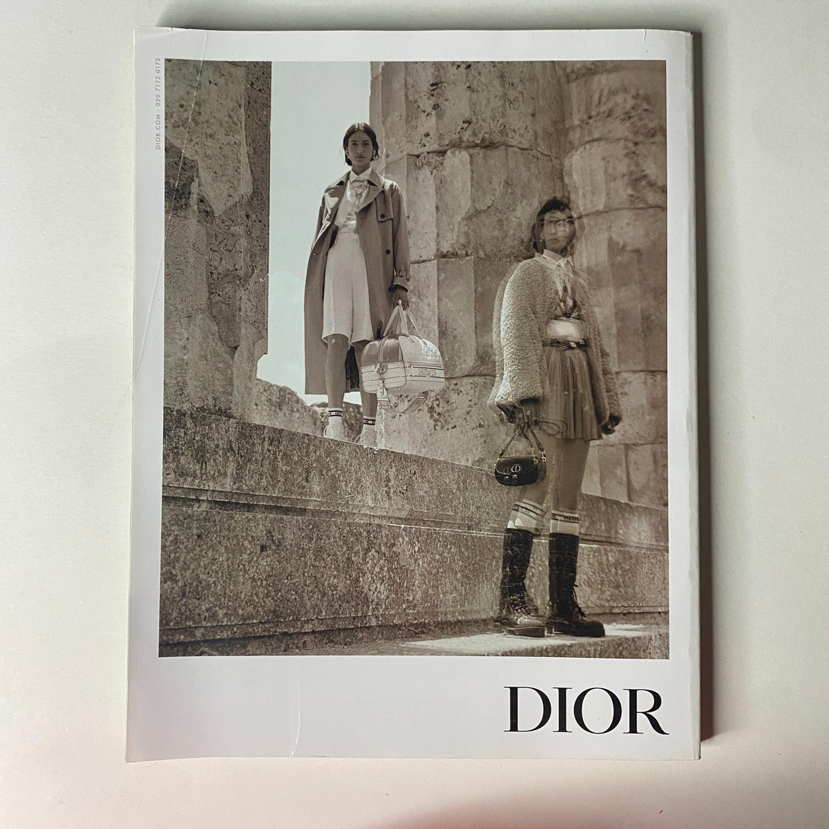 Vogue British Magazine November 2021 Adele Cover - Dior advertisement featuring models in a monochrome aesthetic, highlighting luxury fashion.