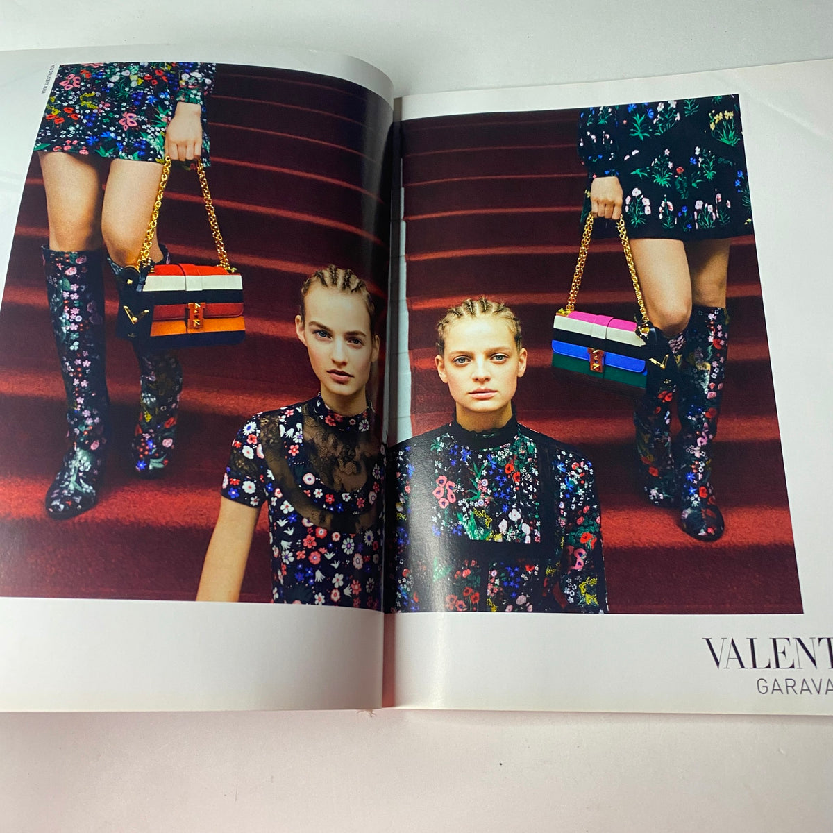 Fashion editorial spread from Vogue British Magazine July 2015 featuring models in vibrant floral outfits by Valentino, celebrating eclectic summer fashion trends.