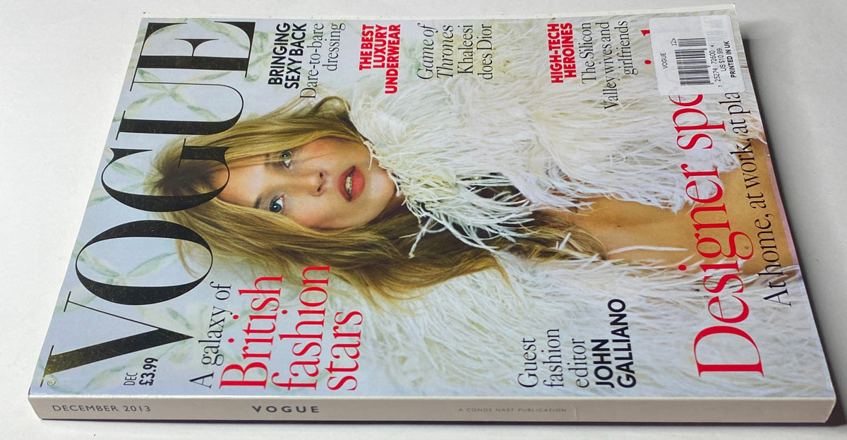 Vogue British Magazine December 2013 with Kate Moss on the front cover, showcasing a fur-lined look and dramatic styling. A festive edition focusing on holiday fashion and cultural commentary.