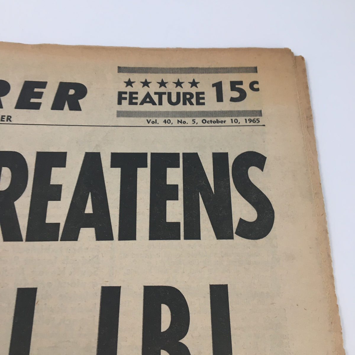 Close-up of the title section of National Enquirer Paper October 10 1965, displaying the date and price with bold text stating 'FEATURE 15c'.