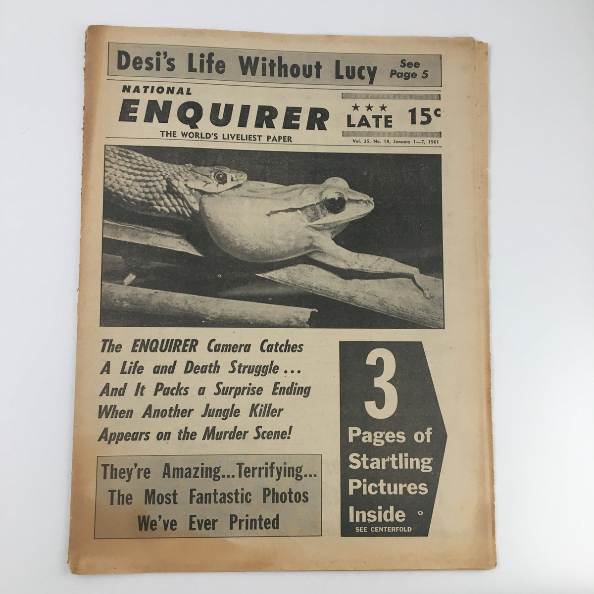 National Enquirer Paper from January 1, 1961, featuring the headline 'Camera Catches A Life and Death Struggle,' showcasing a captivating vintage design and sensational content.