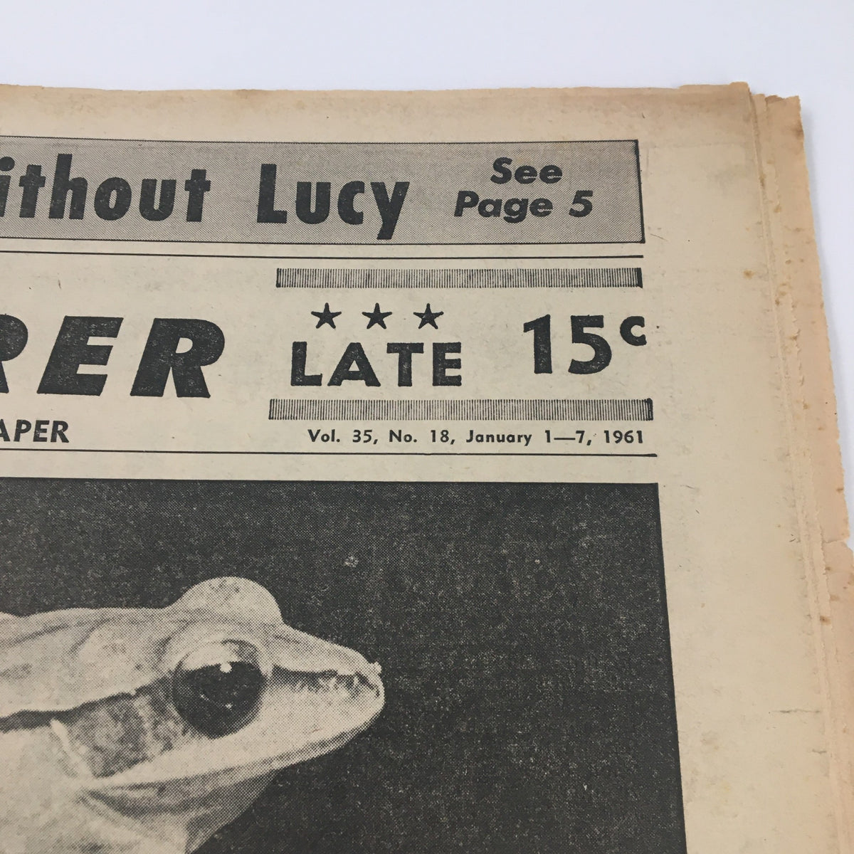 Close-up of National Enquirer Paper January 1 1961 featuring a frog and the price of 15 cents, indicating the publication's age.
