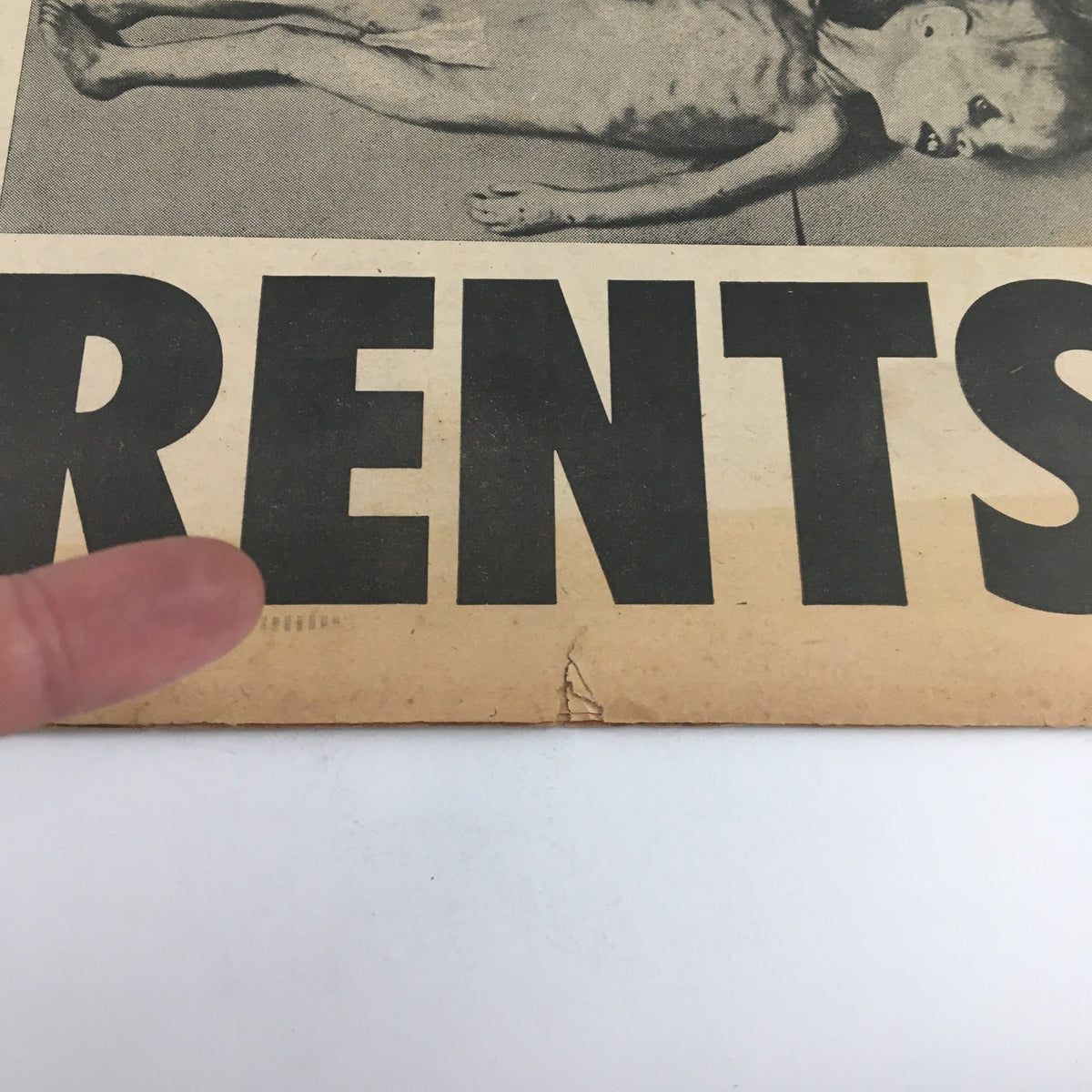 Close-up of the National Enquirer Newspaper dated February 20, 1966, showing a poignant image related to the 13lbs Baby Boy Starved To Death story.
