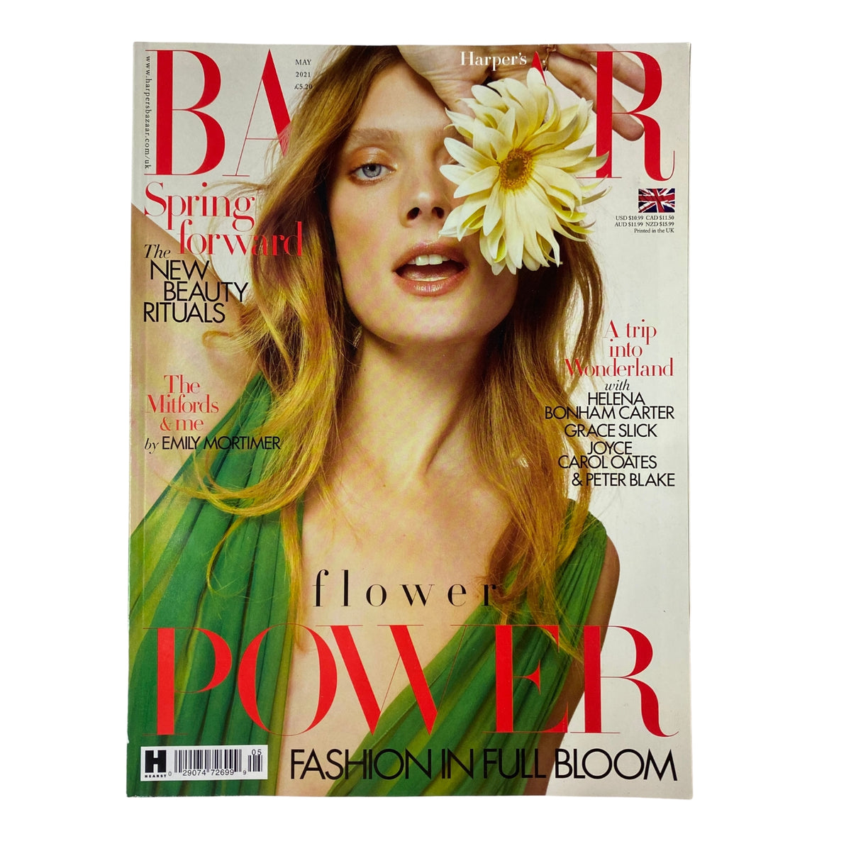 Cover of Harper's Bazaar Magazine May 2021 featuring the theme 'Flower Power: Fashion in Full Bloom'. The cover showcases a model with a daisy in her hair, highlighting vibrant spring fashion.