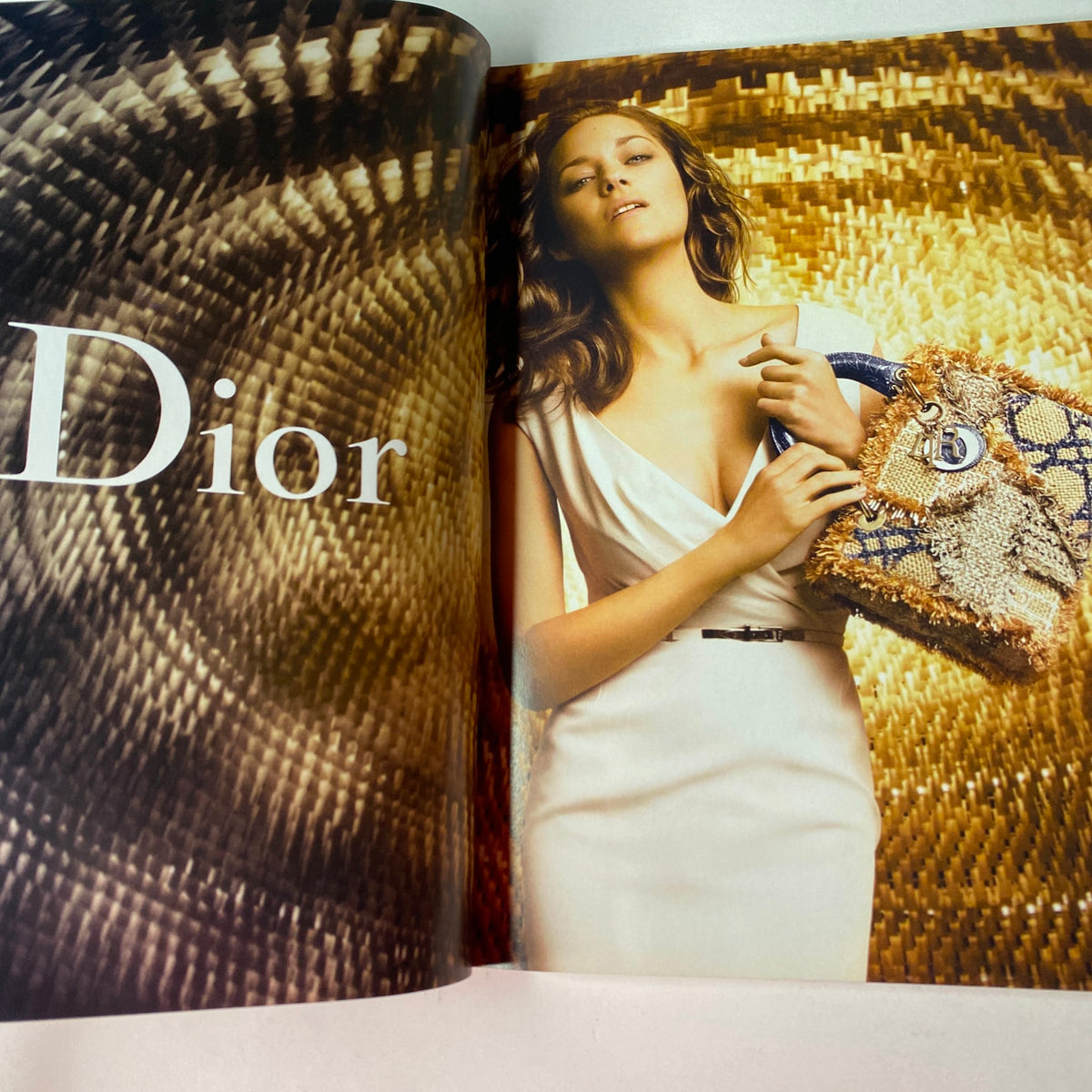 June 2012 Harper's Bazaar magazine featuring a Dior fashion advertisement with a model in a stylish dress, promoting summer fashion trends.