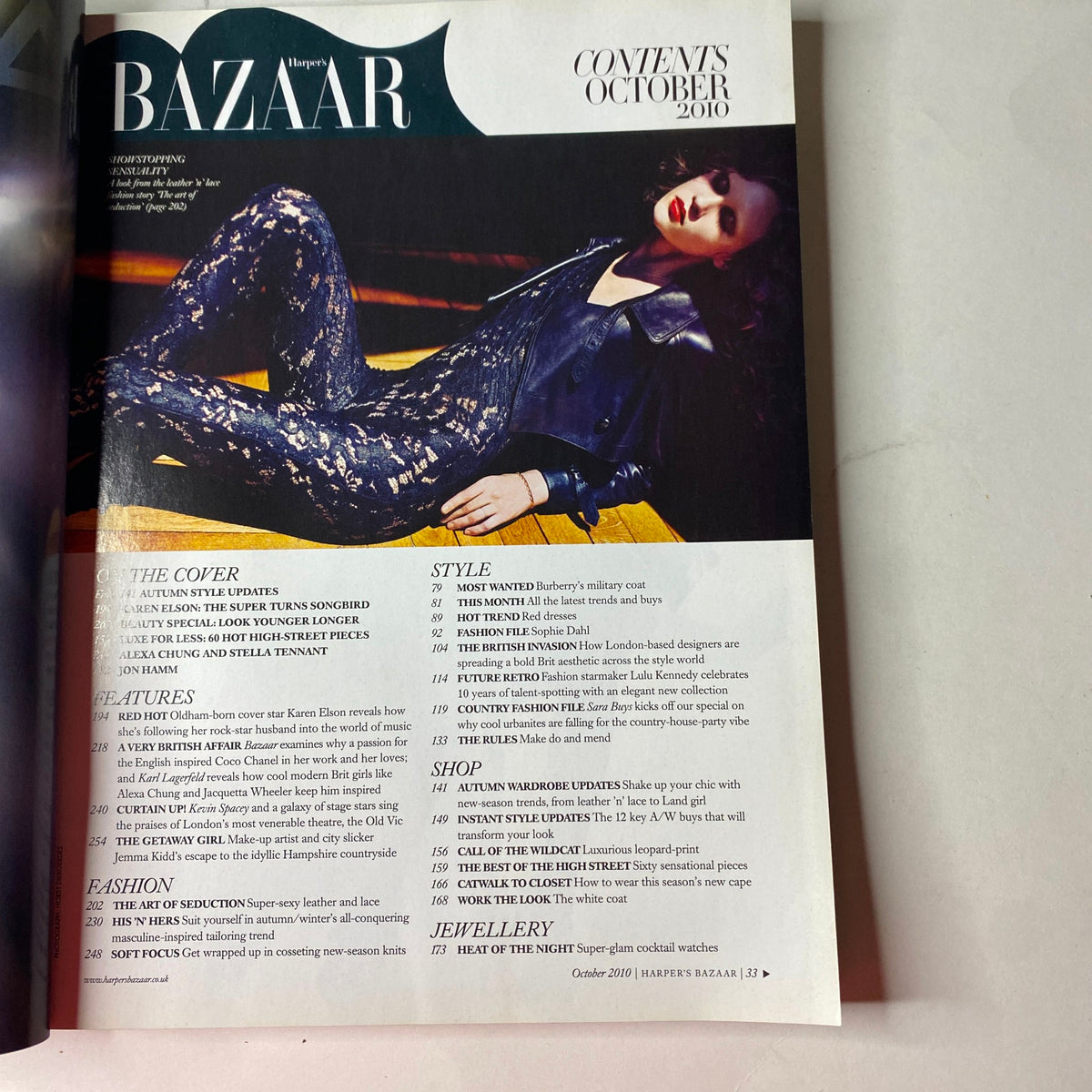 Inside page of Harper's Bazaar Magazine October 2010, showcasing the contents list. Highlights include 'The Super Turns Songbird' featuring Karen Elson and fall fashion features.