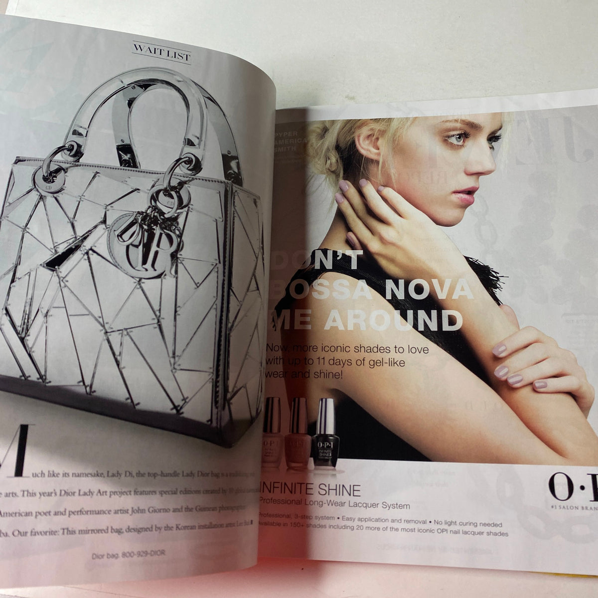 Interior page from Harper's Bazaar Magazine November 2017 featuring a Dior bag and a beauty advertisement showcasing O.P.I Infinite Shine nail lacquer. This page highlights fashion accessories and beauty trends from the iconic magazine.