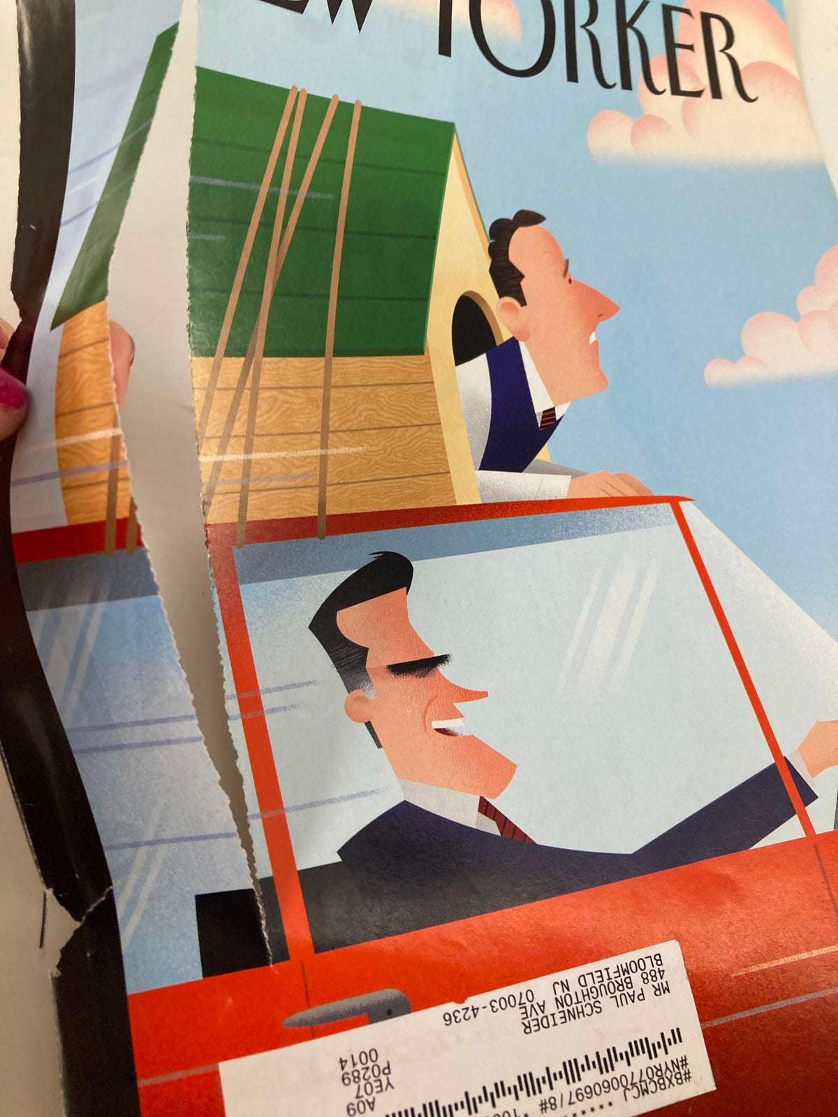 Detail shot of The New Yorker March 12, 2012 cover titled 'State by State' by Bob Staake, showing a tear in the cover, emphasizing the vintage condition of this collectible piece.