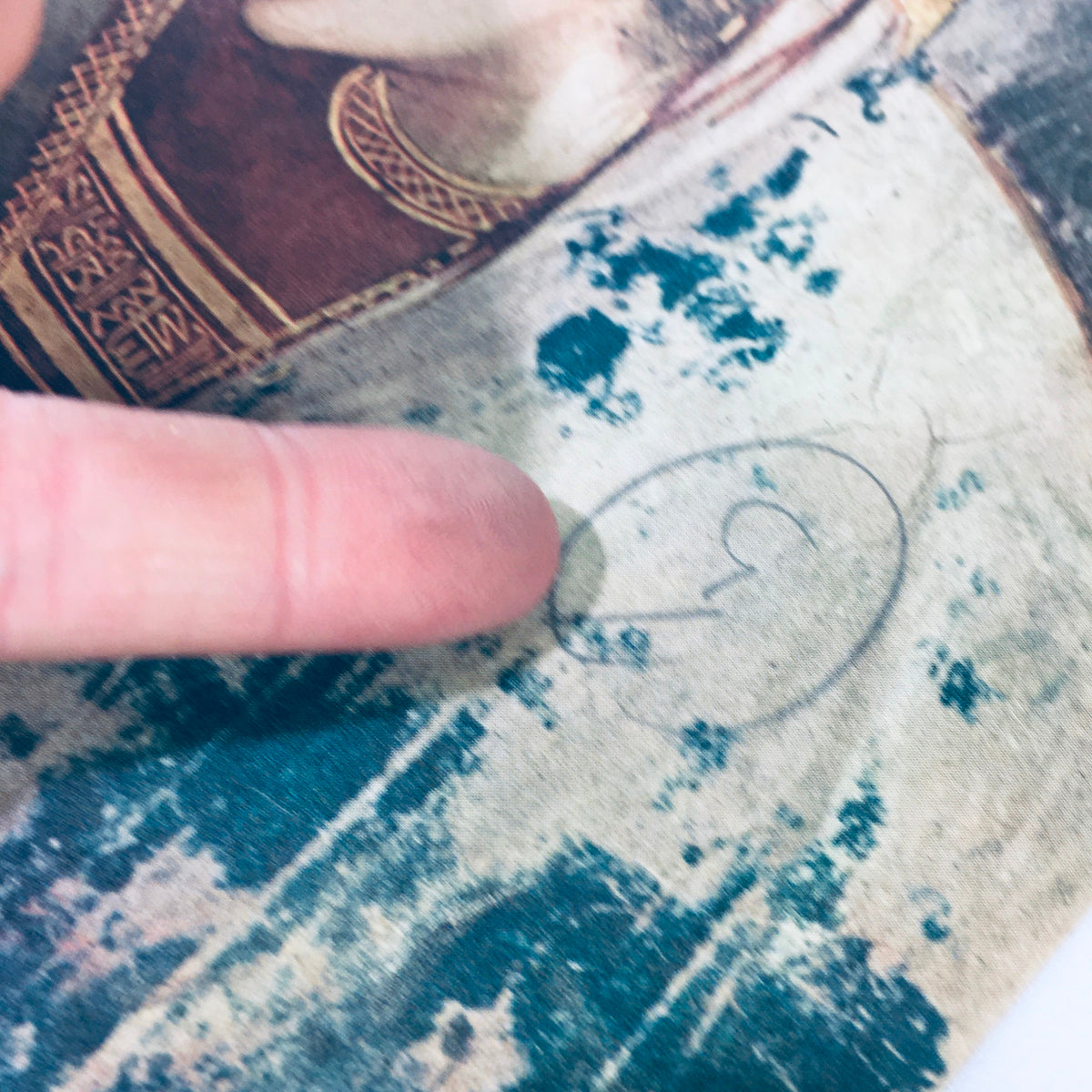 Close-up detail showing vintage Life Magazine December 27, 1948 with a finger pointing at a painting detail, highlighting an artistic mark related to the story of Christ and Giotto's artworks.