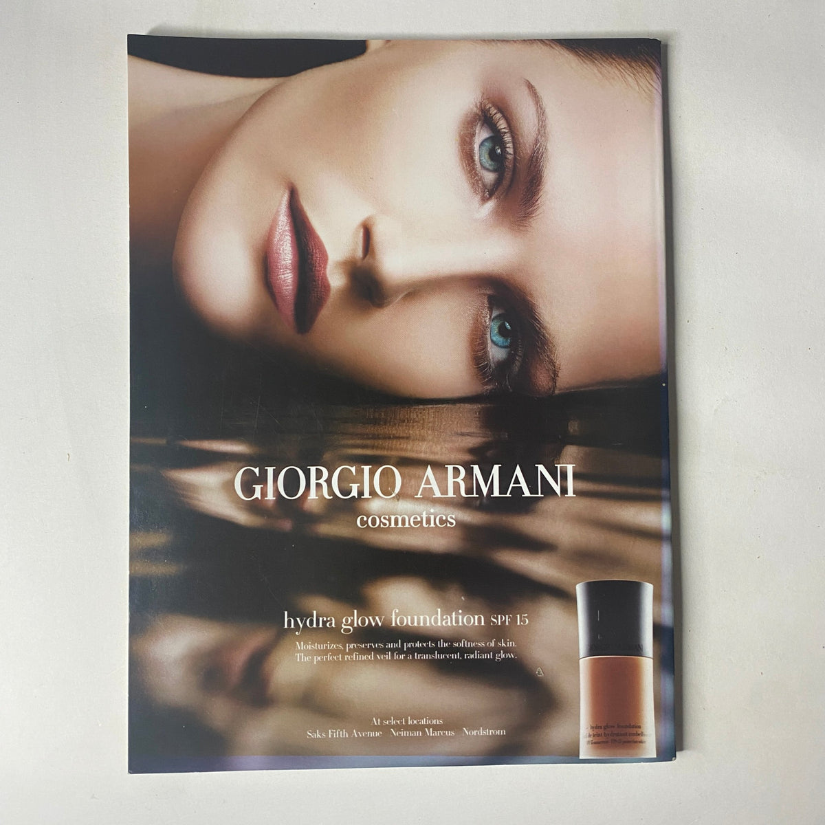 Harper's Bazaar Magazine April 2005 cosmetics advertisement for Giorgio Armani's Hydra Glow Foundation, featuring a model with flawless skin.