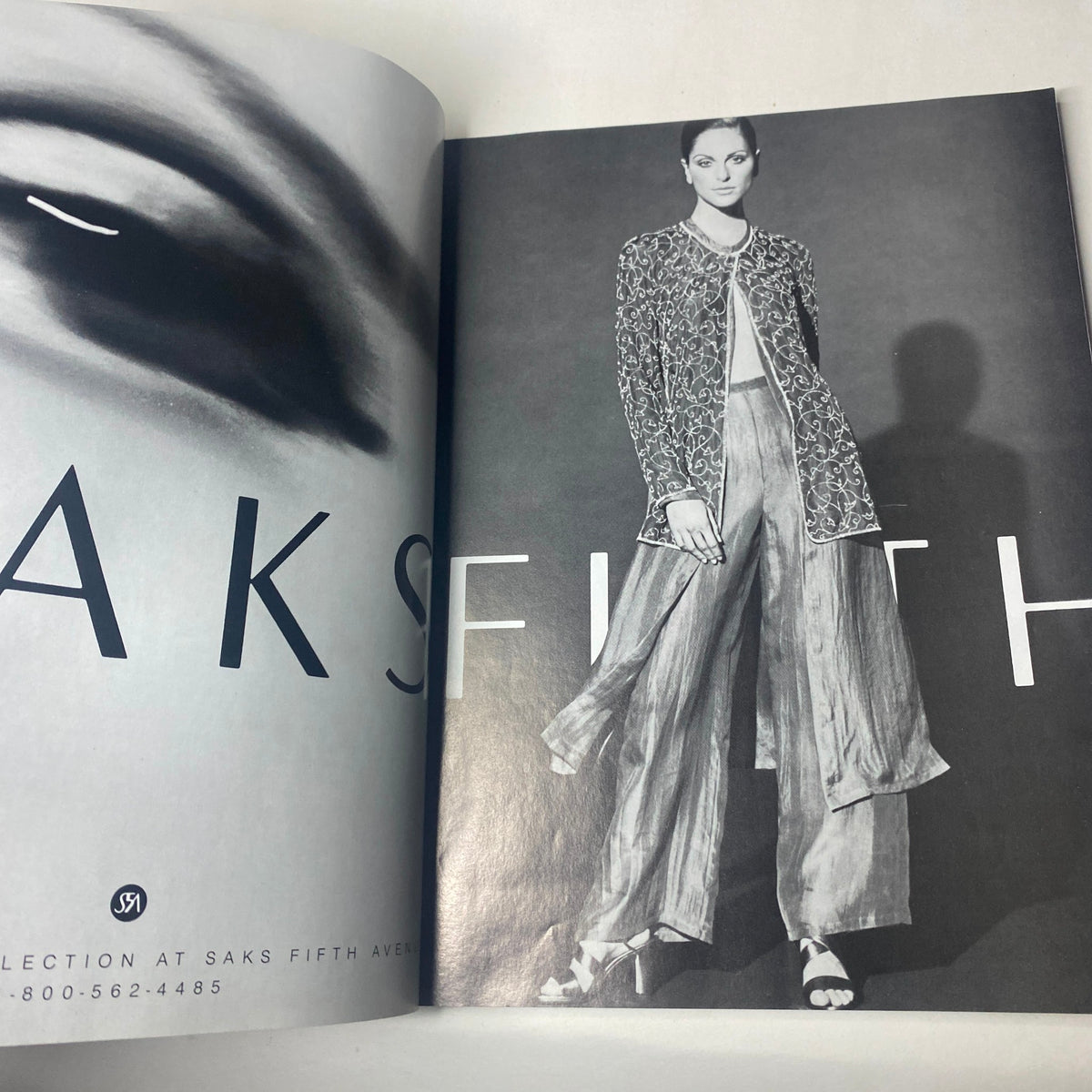 Harper's Bazaar Magazine February 1993 showcasing a Saks Fifth Avenue advertisement, highlighting a model in a stylish ensemble.