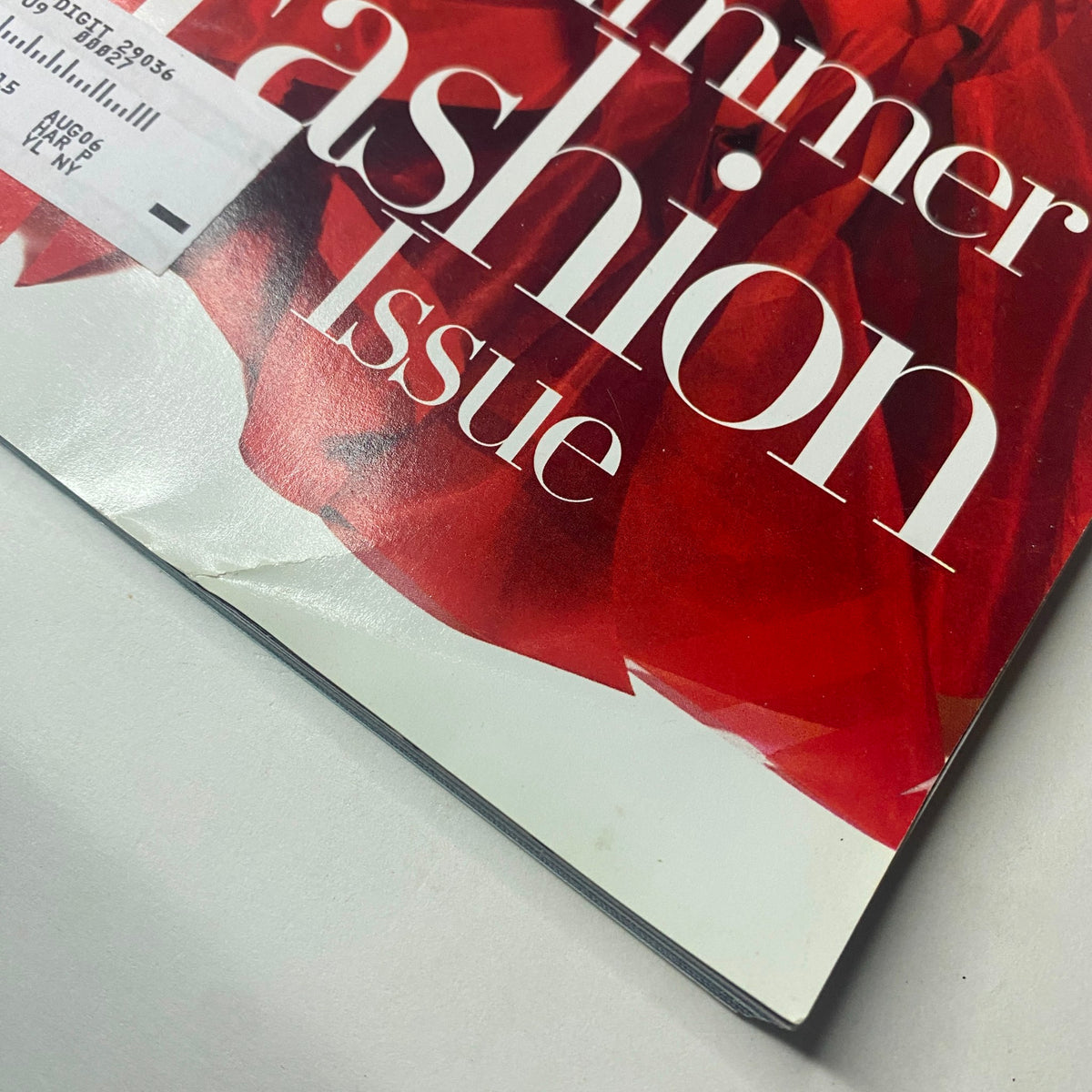 Close-up view of the Harper's Bazaar May 2006 magazine cover featuring Jennifer Lopez, highlighting the Summer Fashion Issue text with delicate red detailing.
